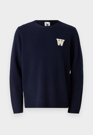 Maglione blu navy realizzato in tessuto morbido, con scollatura a girocollo e polsini a costine, decorato con un logo a lettera 'W' di colore crema sul petto.