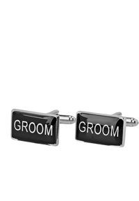 Svarta rektangulära cufflinks med ordet "GROOM" i fet vit text, med en polerad silverram och en slät, glansig yta.