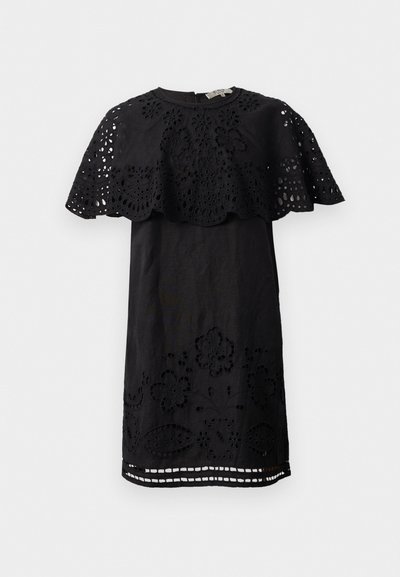 Black dress with floral lace overlay at the shoulders and hem, featuring cut-out details and a round neckline. Made of lightweight fabric.