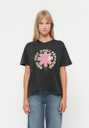 Black cotton t-shirt featuring a colorful graphic design in the center with the text "RED HOT CHILI PEPPERS" in yellow around a pink symbol.