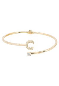 Gold-tone metal cuff bracelet featuring a "C" design adorned with small clear stones and a larger round stone accent.