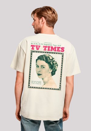 Cremfarbendes T-Shirt mit einem Vintage-Druck eines Frauenporträts, umrahmt von einem dekorativen Rand und mit fettem Text "TV TIMES."