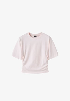 Hellrosa kurzärmeliges, kurz geschnittenes T-Shirt mit rundem Ausschnitt und kleinem schwarzem Etikett innen im Kragen, auf weißem Hintergrund dargestellt.