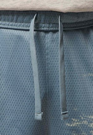 Light blue athletic shorts featuring a breathable mesh texture, adjustable drawstring, and small ventilation holes throughout the fabric.