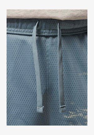 Light blue athletic shorts featuring a breathable mesh texture, adjustable drawstring, and small ventilation holes throughout the fabric.