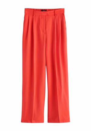 Hohe, weit geschnittene Korallenhose mit Falten, Seitentaschen, Gürtelschlaufen und verdecktem Frontverschluss.