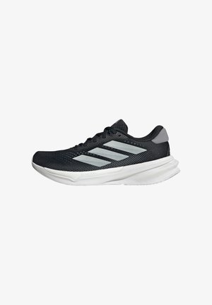 Black running shoe with mesh upper, three silver stripes, white midsole, and textured outsole. Features padded collar and lace closure.