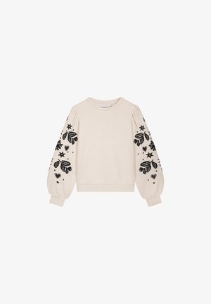 Light beige sweatshirt with puffed long sleeves, featuring black floral and star prints on the sleeves and a ribbed hem.