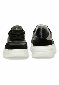 Black and grey sneakers with a mix of leather and suede materials, featuring black laces, a white rubber sole, and glossy accents.