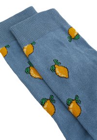Calze blu in morbido tessuto con un motivo ripetuto di limoni, caratterizzate da frutti gialli vivaci e foglie verdi in tutto il design.