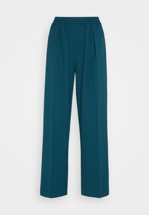 Türkise weit geschnittene Hose aus weichem Stoff mit einem elastischen Bund und vorderen Falten für eine entspannte Passform. Geeignet für Freizeitkleidung.