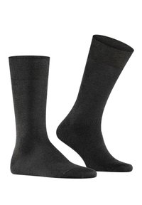 Calze nere realizzate in un materiale liscio e elastico. Presentano una lunghezza classica alla caviglia con punta rinforzata e design senza cuciture.