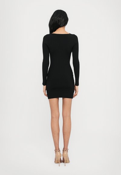 Black ribbed bodycon dress with long sleeves and a square neckline, featuring a fitted silhouette and a short length.