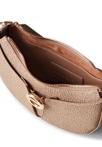 Beige structured handbag with pebbled texture, gold-tone hardware, and smooth brown interior. Features a zip closure and front pocket.