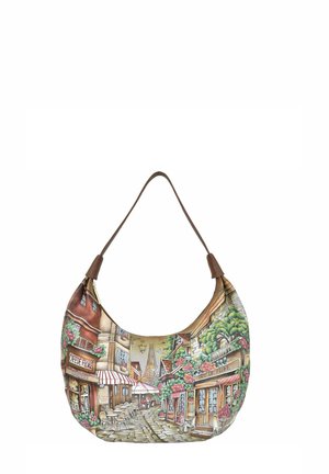 Hobo-style handbag with a painted street scene in muted colors, featuring floral accents and a brown leather strap.