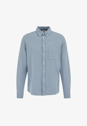 Világoskék, hosszú ujjú ing, gombos gallérral, textúrált anyagból, mellzsebével. Bézs gombok díszítik az elejét.