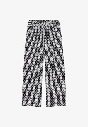 Laiade lõikega püksid mustvalge geomeetrilise teemantmustriga ja elastse vöökohaga.