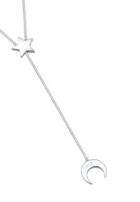 Sølv halskæde med en tekstureret stjerne og halvmåne vedhæng. Kæden har et delikat design med synlig 925-stempel for sterling sølv.