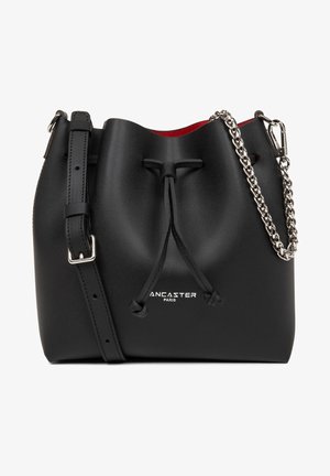 Black leather bucket bag with a drawstring closure, silver chain accent, and red interior. Features adjustable strap and logo detail.