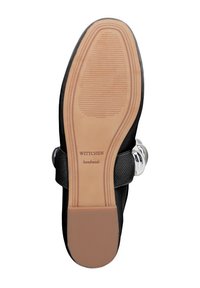 Suola nera di scarpa con battistrada in gomma, soletta in pelle marrone chiaro e un'accenno argentato. Il testo dice "WITTCHEN fatto a mano." Texture liscia, forma ovale.