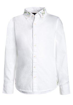 Hvid langærmet skjorte med knapper, blomstret broderi på kraven og små sideslids.