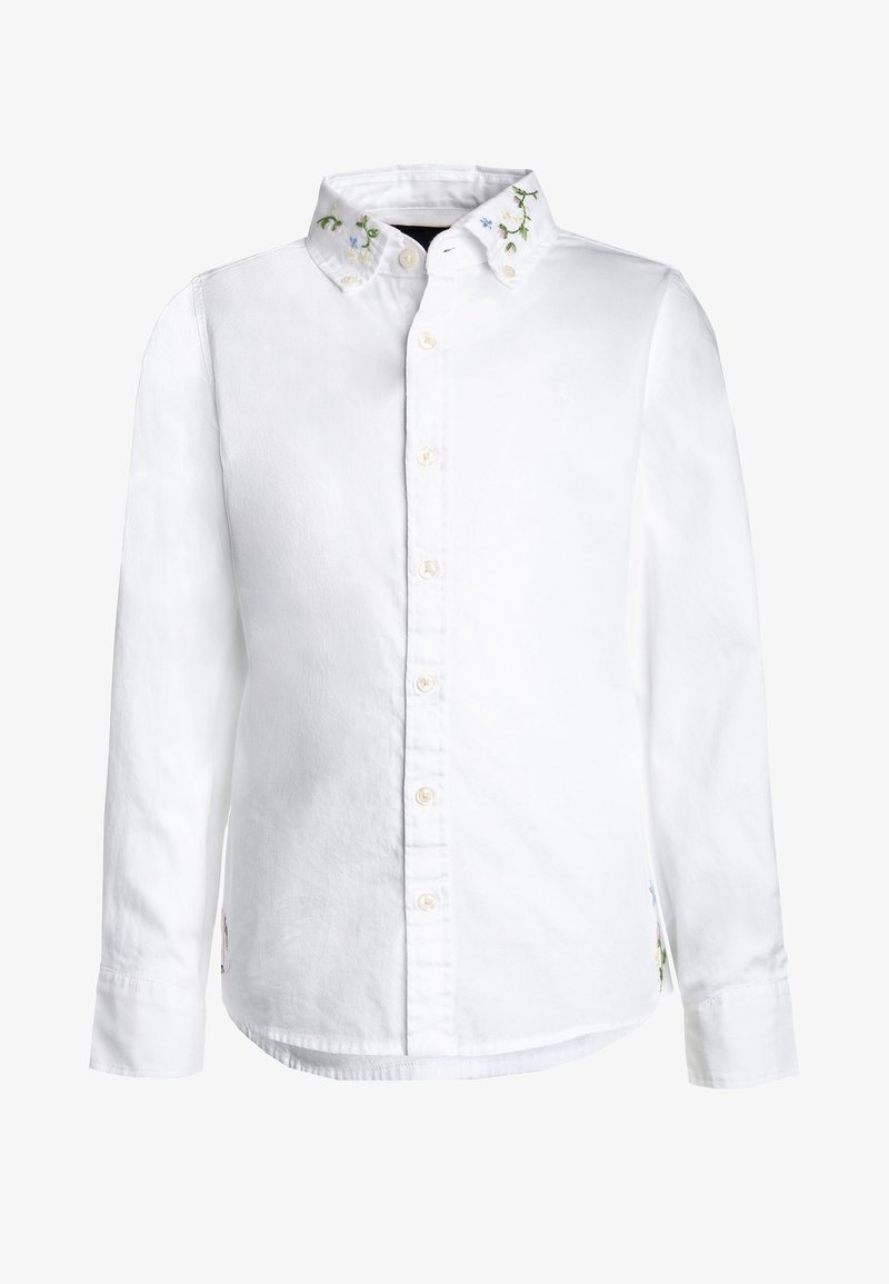 Chemise blanche à manches longues boutonnée avec broderie florale sur le col et petites fentes latérales.