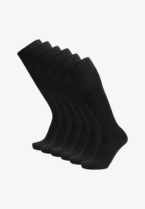 Sechs Paar schwarze, mittellange, gerippte Socken nebeneinander angeordnet, vor weißem Hintergrund gezeigt.
