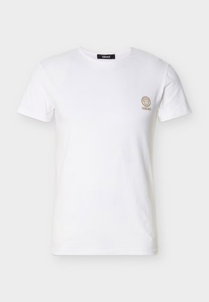 Biele bavlnené tričko s okrúhlym výstrihom, krátkymi rukávmi a zlatým vyšívaným logom Versace na ľavej strane na hrudi.