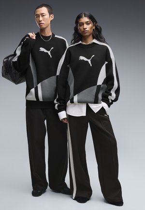 Puma, T7 RELAXED KNIT SWEATER UNISEX - Strickpullover - black