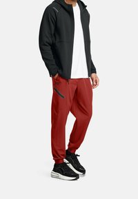 Under Armour Tygbyxor - orange