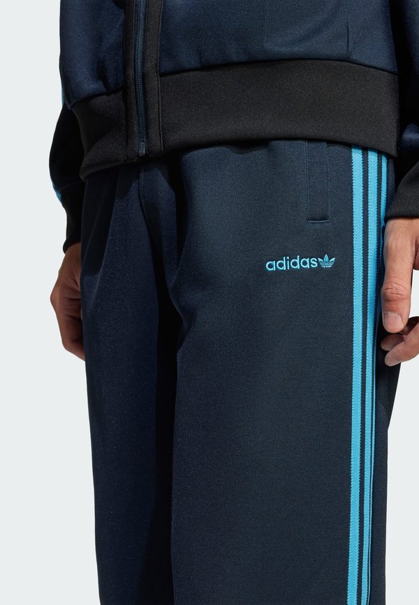 TRACK PANTS - Tracksuit bottoms - aurora ink2