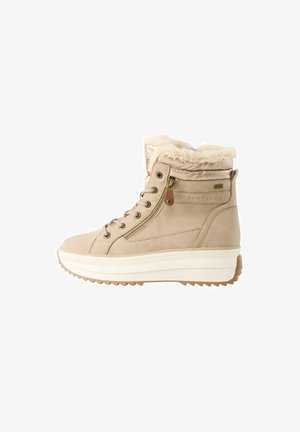 Beige ankle boots with faux fur lining, suede material, padded collar, white platform sole, and side zip closure. Textured outsole for grip.