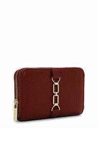 Red leather wallet with a textured finish, featuring a gold-tone chain accent and a zip closure along one side.