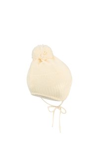 Cream knit baby hat with pom-pom on top and tied chin straps for secure fit.