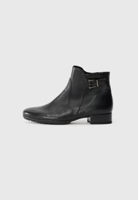 Black leather ankle boot with low heel, side buckle detail, and slightly pointed toe, shown in profile on a plain background.