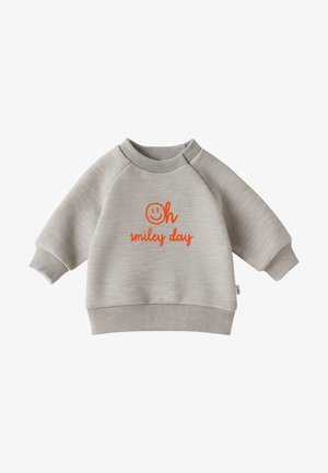 Light gray sweatshirt with raglan sleeves, ribbed cuffs, and hem. Features orange text "Oh smiley day" and a smiley face graphic. Cotton blend fabric.