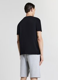 Calliope GINNICO - Pantalon de survêtement - grigio chiaro melange