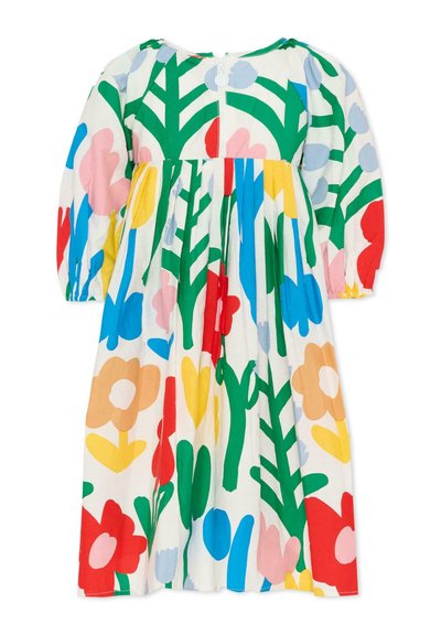 Vestito bambino a maniche lunghe con motivi floreali vivaci in rosso, blu, giallo, rosa, verde e beige su sfondo bianco.