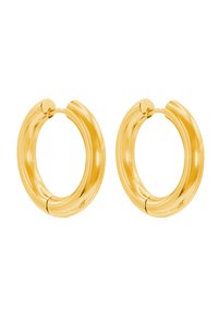 Orecchini a cerchio in oro con una finitura liscia e lucida. Design arrotondato con una leggera torsione; chiusura sicura visibile nella parte superiore.