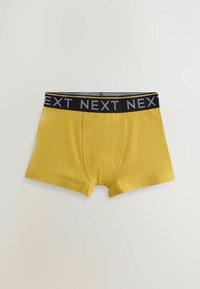 Gula boxershorts med en svart midjeband som har ordet "NEXT" i grått upprepat. Slät tyg med en åtsittande design och horisontell gylf.