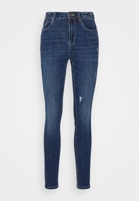 Tajta jeans i mörkblå denim. Funktioner inkluderar en femficksdesign, subtila blekningar och lätt slitna detaljer på benen.