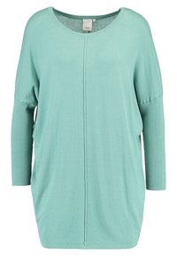 Mynta grön tröja med rund halsringning, långa ribbade ärmar, avslappnad passform och central sömdetalj. Mjuk textur och lättviktsmaterial.