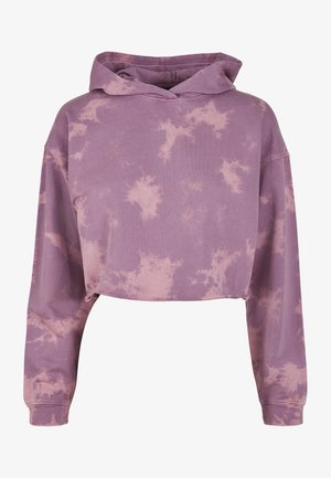 Skórzana bluza z krótkim krojem w jasnofioletowym kolorze z wzorem tie-dye. Posiada długie rękawy oraz sznurki w kapturze, wykonana z miękkiego materiału bawełnianego.