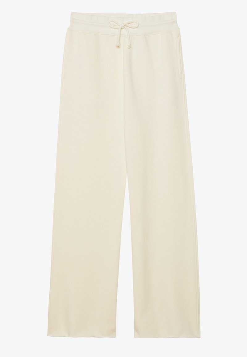 Pantaloni della tuta a gamba larga color crema con vita regolabile, realizzati in tessuto morbido e liscio e dotati di tasche frontali. Senza motivi o dettagli visibili.