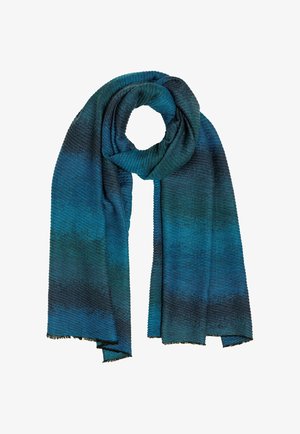 Knit scarf featuring gradient shades of teal and dark blue, with a textured ribbed design and fringed edges. Soft, lightweight fabric.