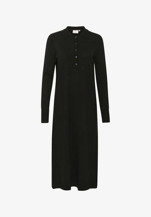 Lang sort kjole lavet af strikstof, der har en krave og en knapstolpe. Ærmerne er lange med tætsiddende manchetter. Enkel og sømløs design.