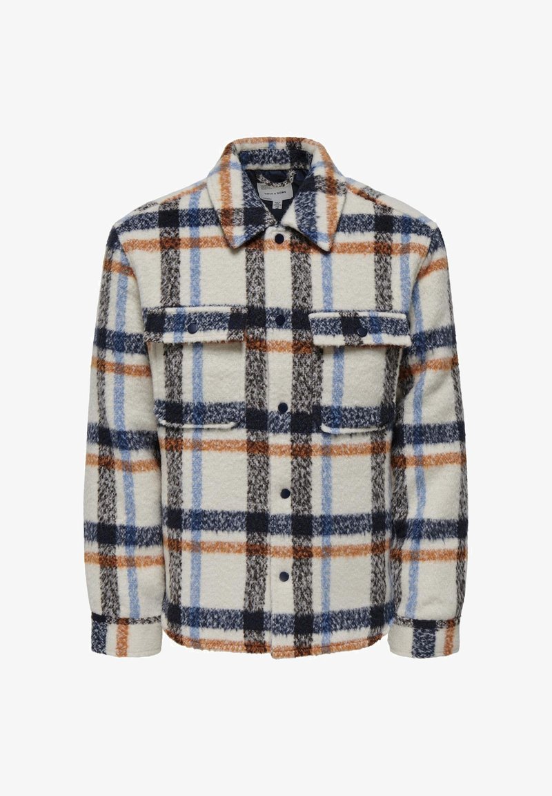 Plaid fleece shirt jacket in cream, featuring blue, orange, black patterns, a collar, two chest pockets, and button closures.