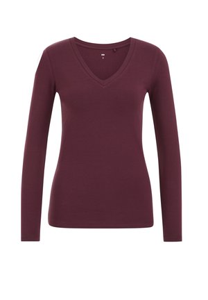 Chemise à manches longues, cintrée, de couleur violet foncé avec un décolleté en V et un design uni sur un fond blanc.