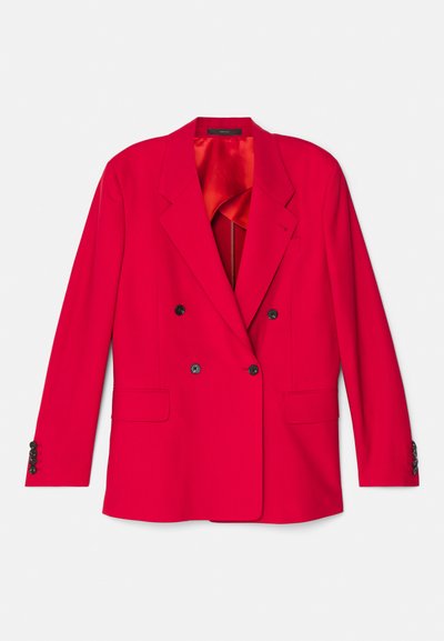 Blazer rouge à double boutonnage avec des revers crantés, deux poches avant et des boutons noirs. Doublé d'un tissu orange pour le contraste et la texture.
