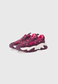 Purple and pink athletic shoes with a textured upper, prominent white midsole, and patterned accents. Features laces and a pull tab.